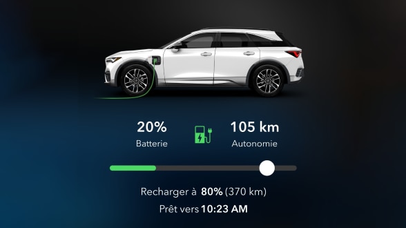 Vue latérale d’un ZDX blanc avec une prise verte branchée dans son port de recharge. Une barre d’état indique la charge de la batterie et l’autonomie estimée.