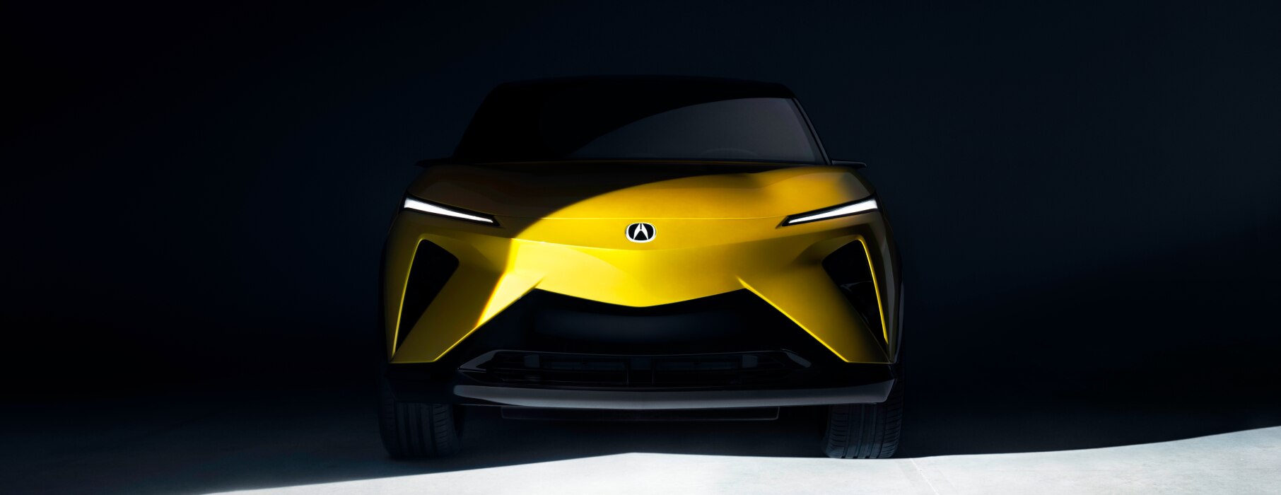 Front view of a gold RSX prototype in a black space. 