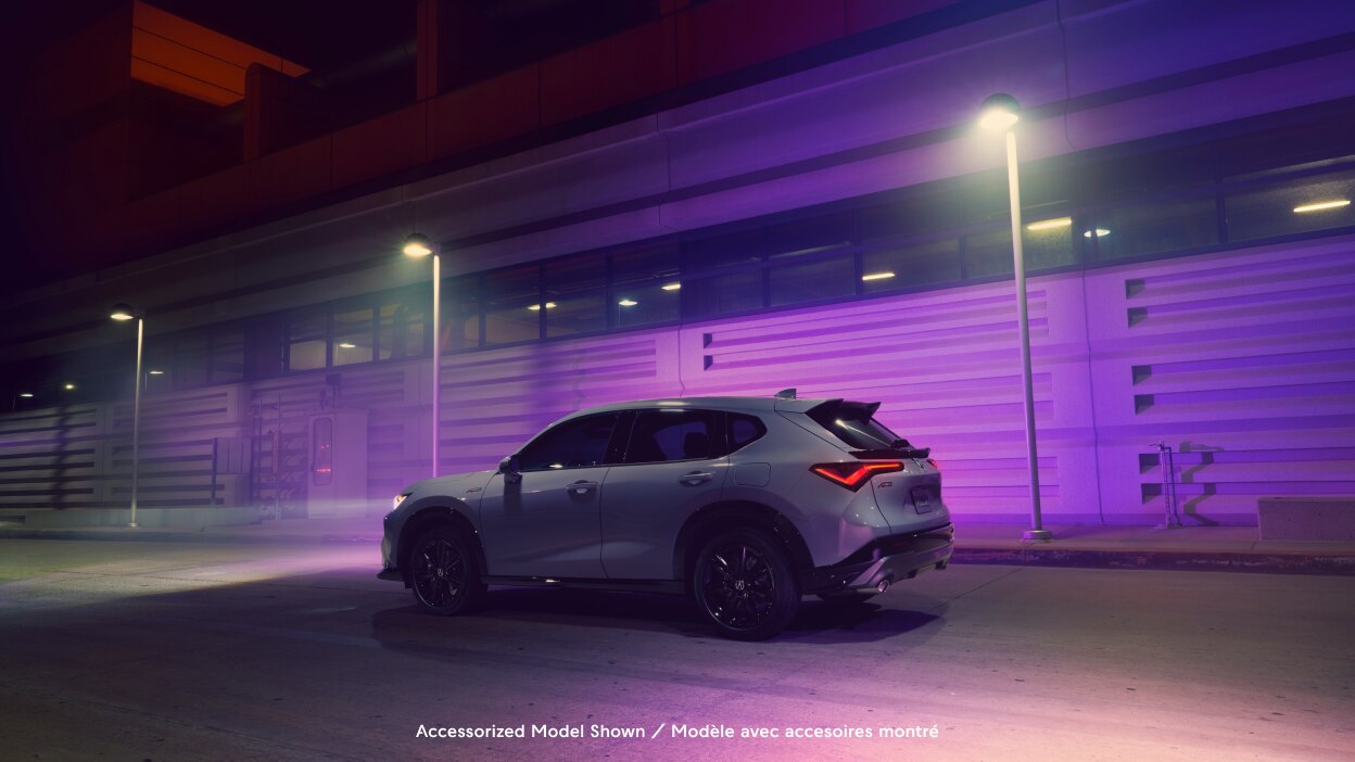 Side-view of an Acura ADX in an urban environment. 