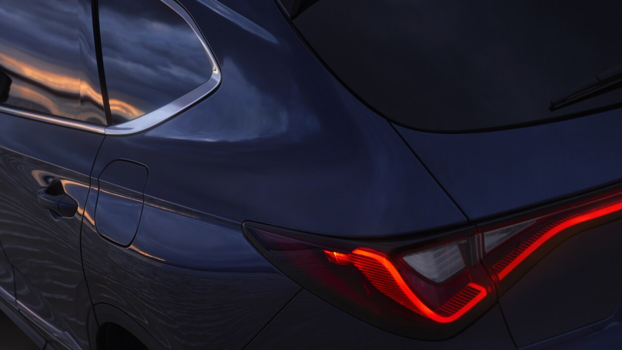 The tail light of a red MDX.