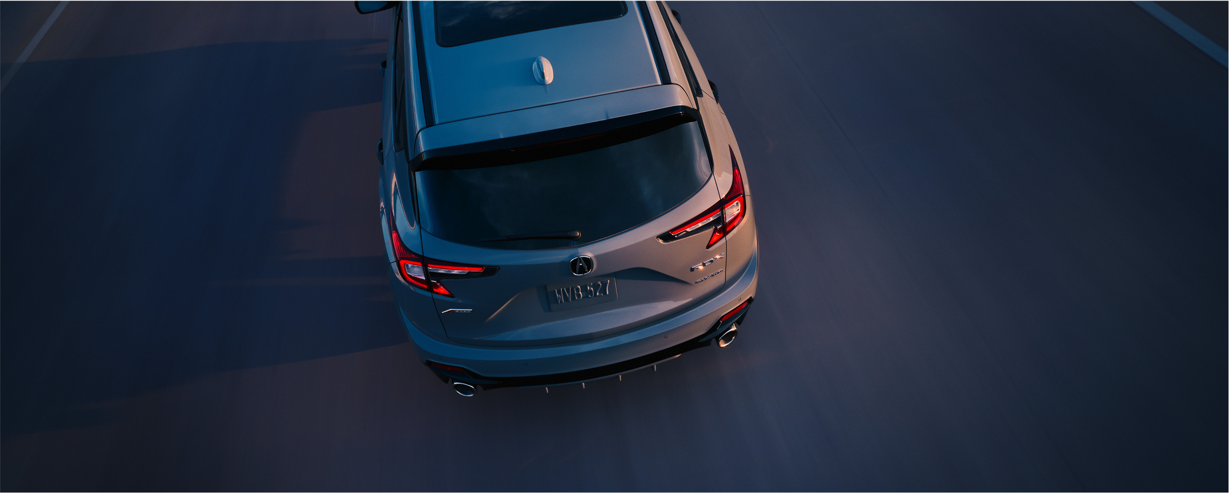 Profile view of front fender on red RDX, displaying “A-SPEC” emblem.