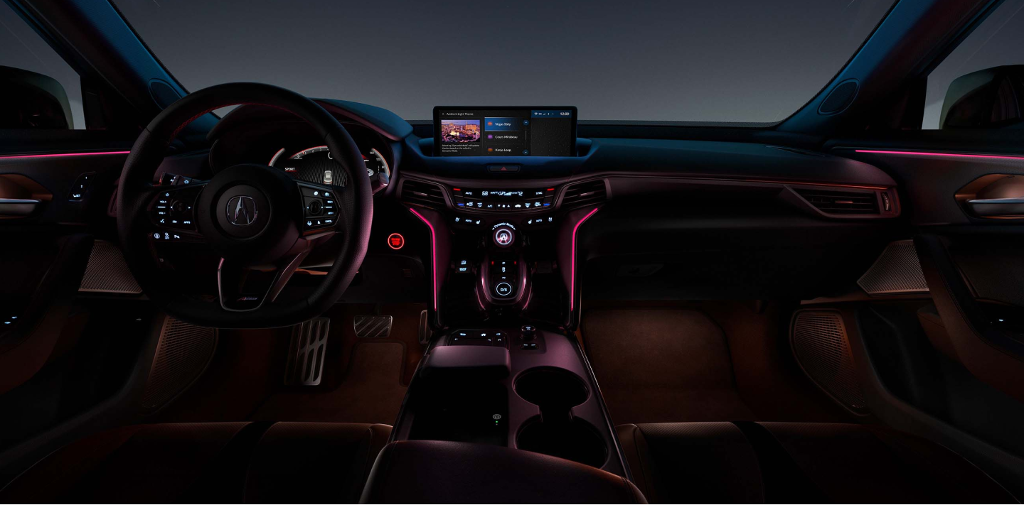 Wide interior view of the cockpit, steering wheel, and dashboard in a TLX.